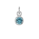 Swiss Blue Topaz birthstone charm in 14k white gold — bright blue December gemstone jewelry.
