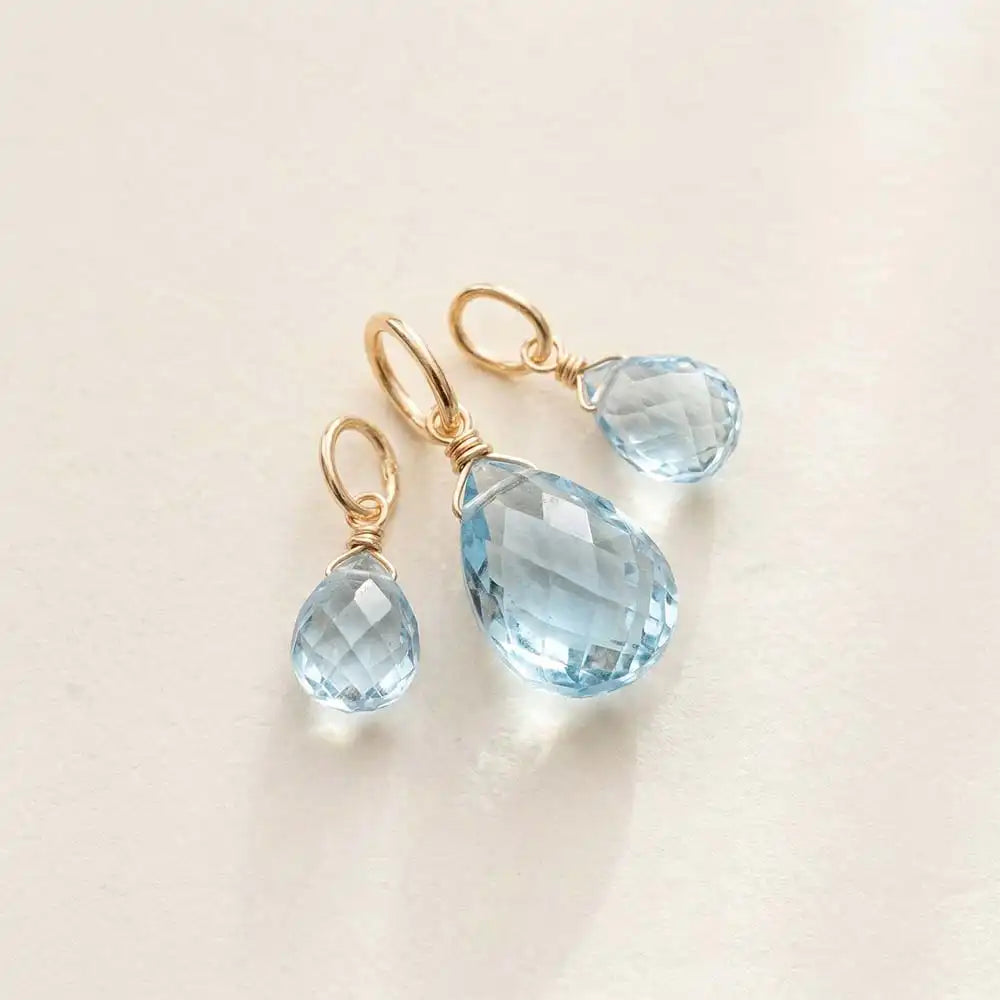 Petite swiss topaz gemstone in briolette cut, 6mm, finished with elegant gold-fill wirework.