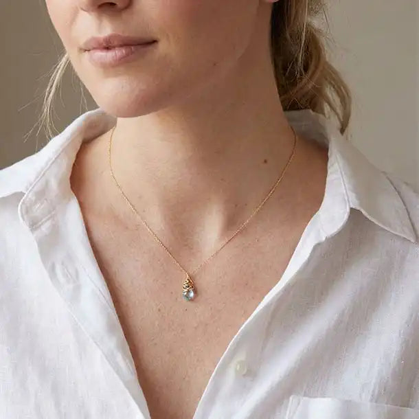 Natural swiss blue topaz pendant necklace shown on model variant--Gold-fill, variant--Sterling-silver,  variant--Rose-Gold-fill, variant--Oxidized-sterling-silver, variant-variant--Swiss-topaz 