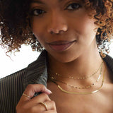 Tiny diamond stackable ring in 14K gold, side profile