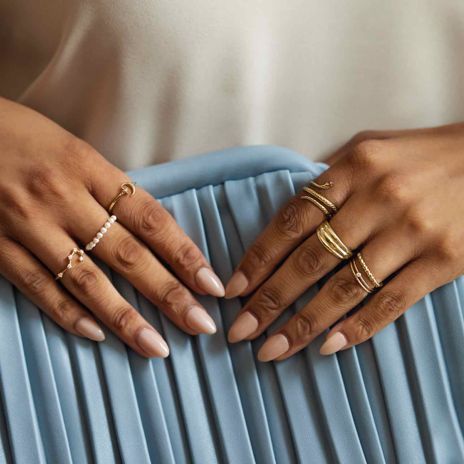 Tiny diamond stackable ring in 14K gold, on hand