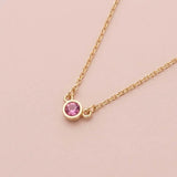 Bezel-set tourmaline birthstone necklace in 14K rose gold on cable chain