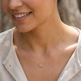 Minimalist birthstone necklace featuring Tourmaline shown on model variant--14K-yellow-gold variant--14K-white-gold variant--14K-rose-gold variant--Sterling-silver variant--Tourmaline