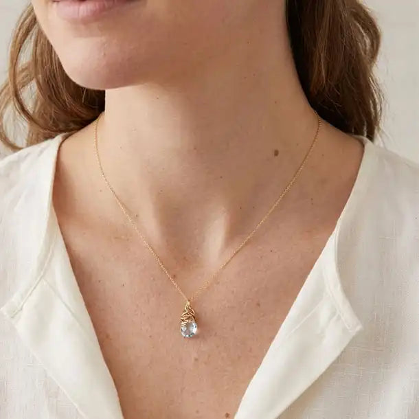 Natural white topaz pendant necklace shown on model variant--Gold-fill, variant--Rose-gold-fill, variant--Sterling-silver, variant--Oxidized-sterling-silver variant--White-Topaz