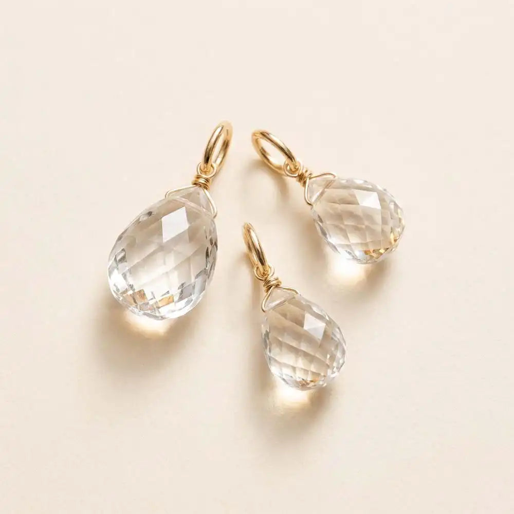 gold-fill-wrapped white topaz briolette charm in 6mm, ideal for meaningful gemstone jewelry.