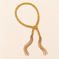 Yellow braided chain and silk tassel bracelet in 14K gold-fill, flat lay