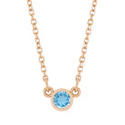 Bezel-set blue zircon birthstone necklace in 14K rose gold, product view