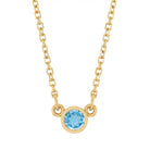 Bezel-set blue zircon birthstone necklace in 14K yellow gold, product view