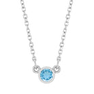 Bezel-set blue zircon birthstone necklace in sterling silver, product view