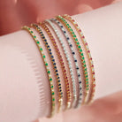 Bracelet styled stacked with other bracelets— casual luxe