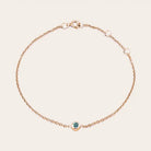 Bezel-set alexandrite bracelet in 14K rose gold, close-up of setting