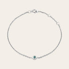 Model wearing bezel-set birthstone bracelet. variant--14K rose gold