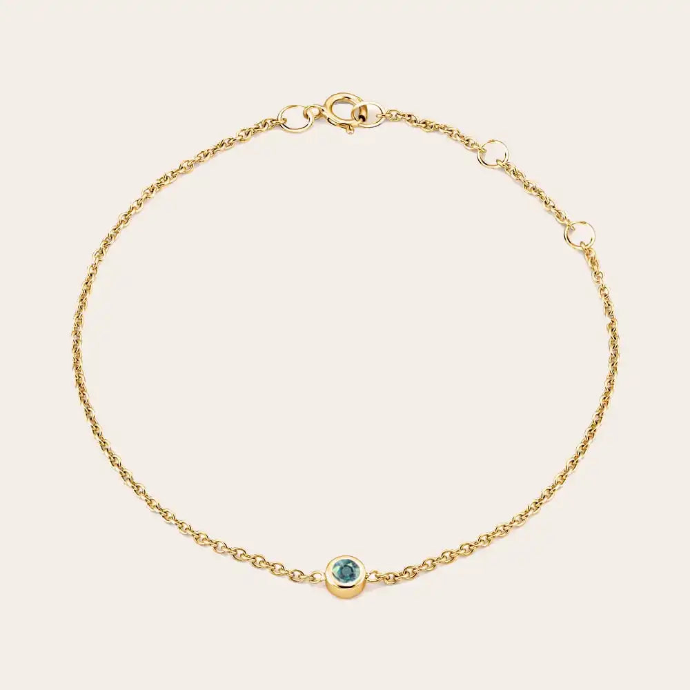 Close up of spring adjustable bezel-set bracelet. yellow gold variant--14K-yellow-gold variant--Alexandrite