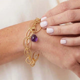 Natural amethyst woven chain bracelet in sterling silver, close-up of setting in gold-fill variant--Gold-fill variant--Sterling-silver variant--Amethyst