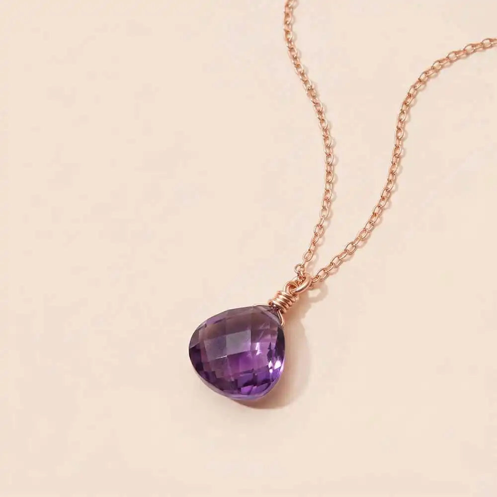 Amethyst necklace with faceted purple gemstone on a delicate chain