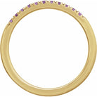 Layerable gold ring featuring 11 sparkling purple amethysts detail