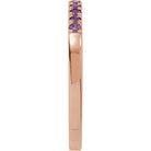 Rose gold amethyst stacking ring with deep purple gems side view