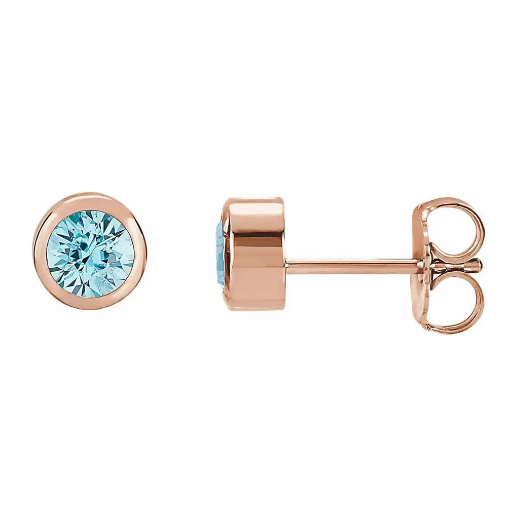 Aquamarine bezel stud earrings side view in 14K rose gold