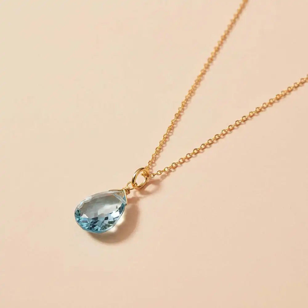 Minimal aquamarine pendant necklace with soft ocean-blue sparkle