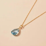 Minimal aquamarine pendant necklace with soft ocean-blue sparkle