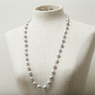 Long baroque pearl necklace worn as a statement piece