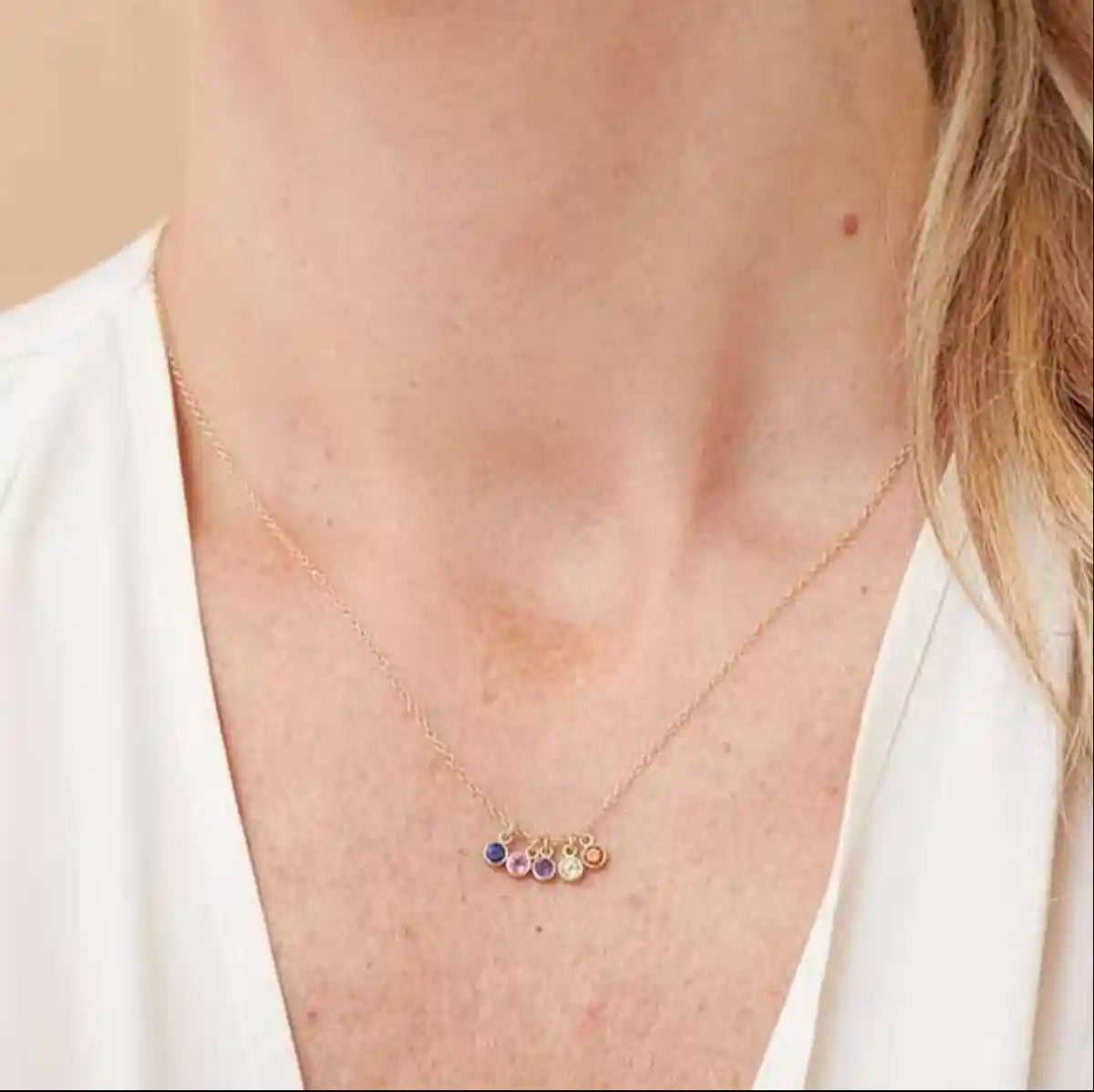 Birthstone charm necklace styled on model