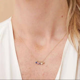 Birthstone charm necklace styled on model