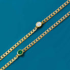 Minimalist gold bracelet with bezel gemstone and flat link design