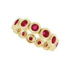 Round bezel-set ruby eternity ring in 10K yellow gold, handmade with lab-created gems
