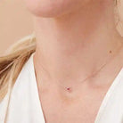 Bezel-set ruby necklace on model