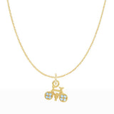 Close-up of petite 8.15×7.15 mm bicycle charm with topaz accents on 16" cable chain.