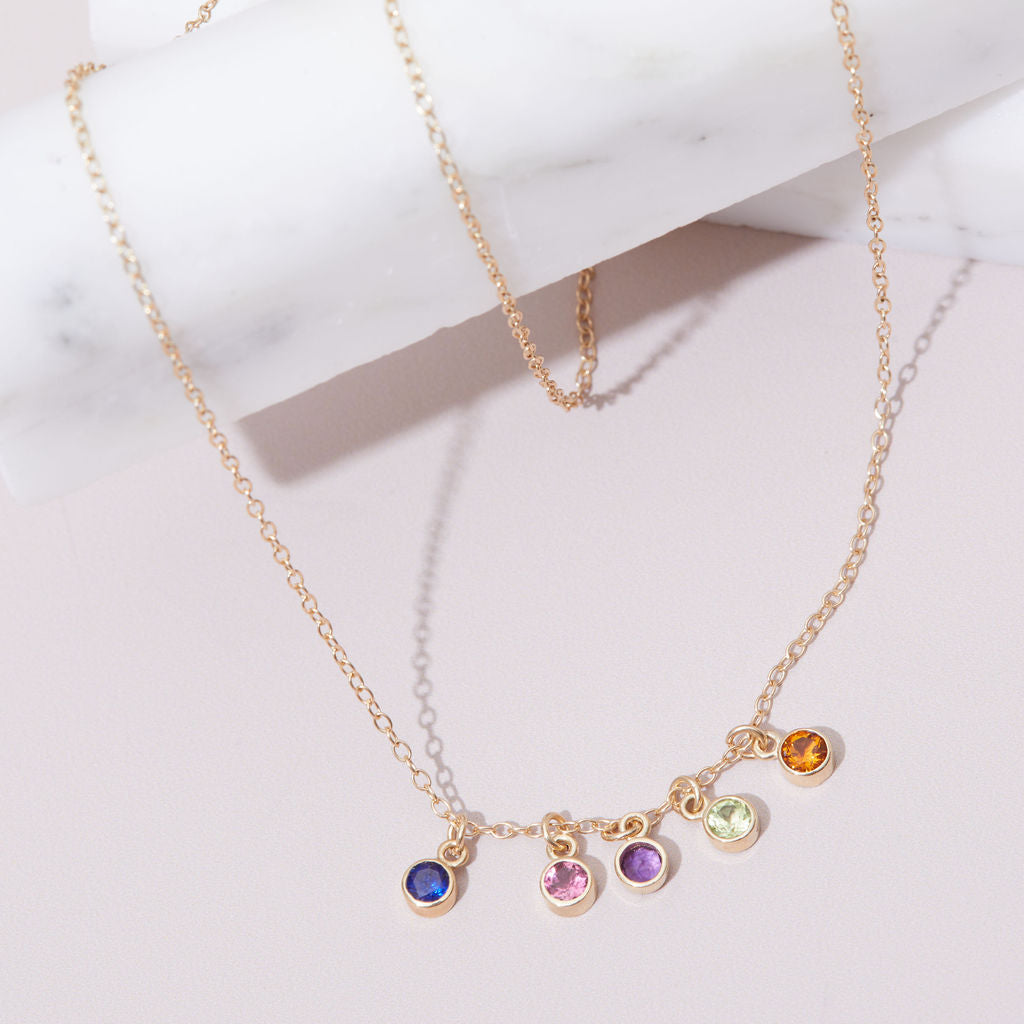 Necklace with bezel-set birthstone charms in 14k gold — timeless, sentimental jewelry for birthdays or anniversaries