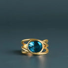 Criss-cross London Blue Topaz cocktail ring in 10K gold