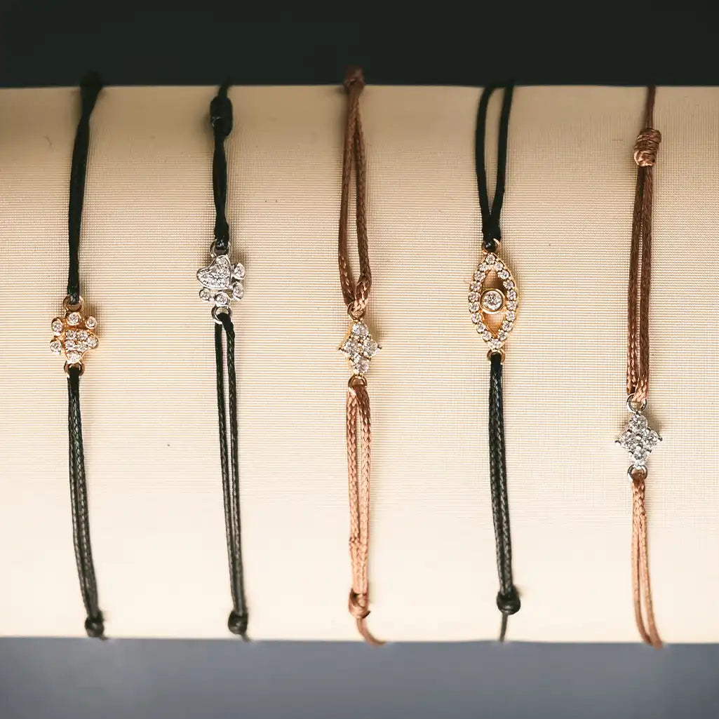 Bracelet Stack with diamond charm skip knot bracelets