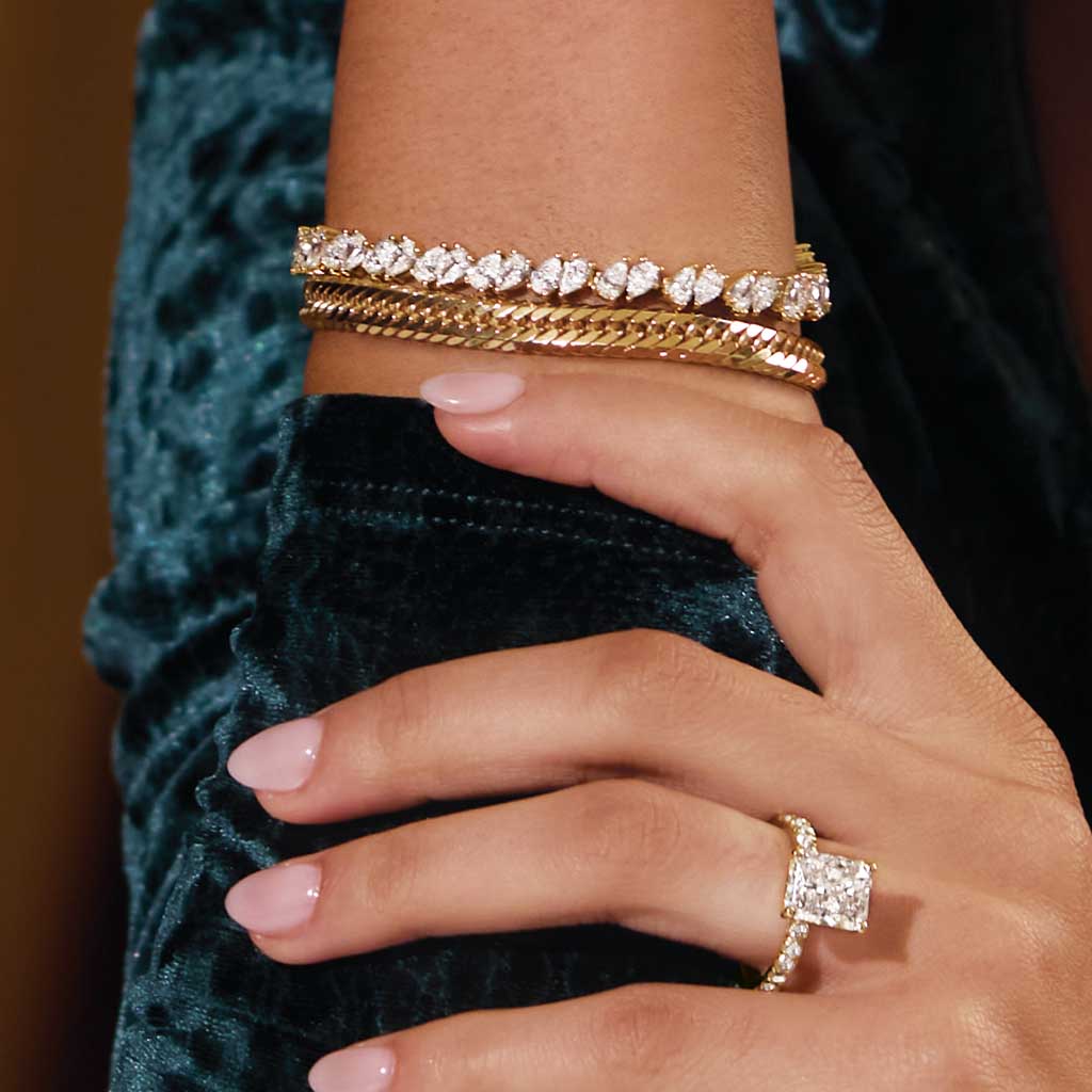 Mixed pear tennis bracelet on model wrist, showing alternating pear layout