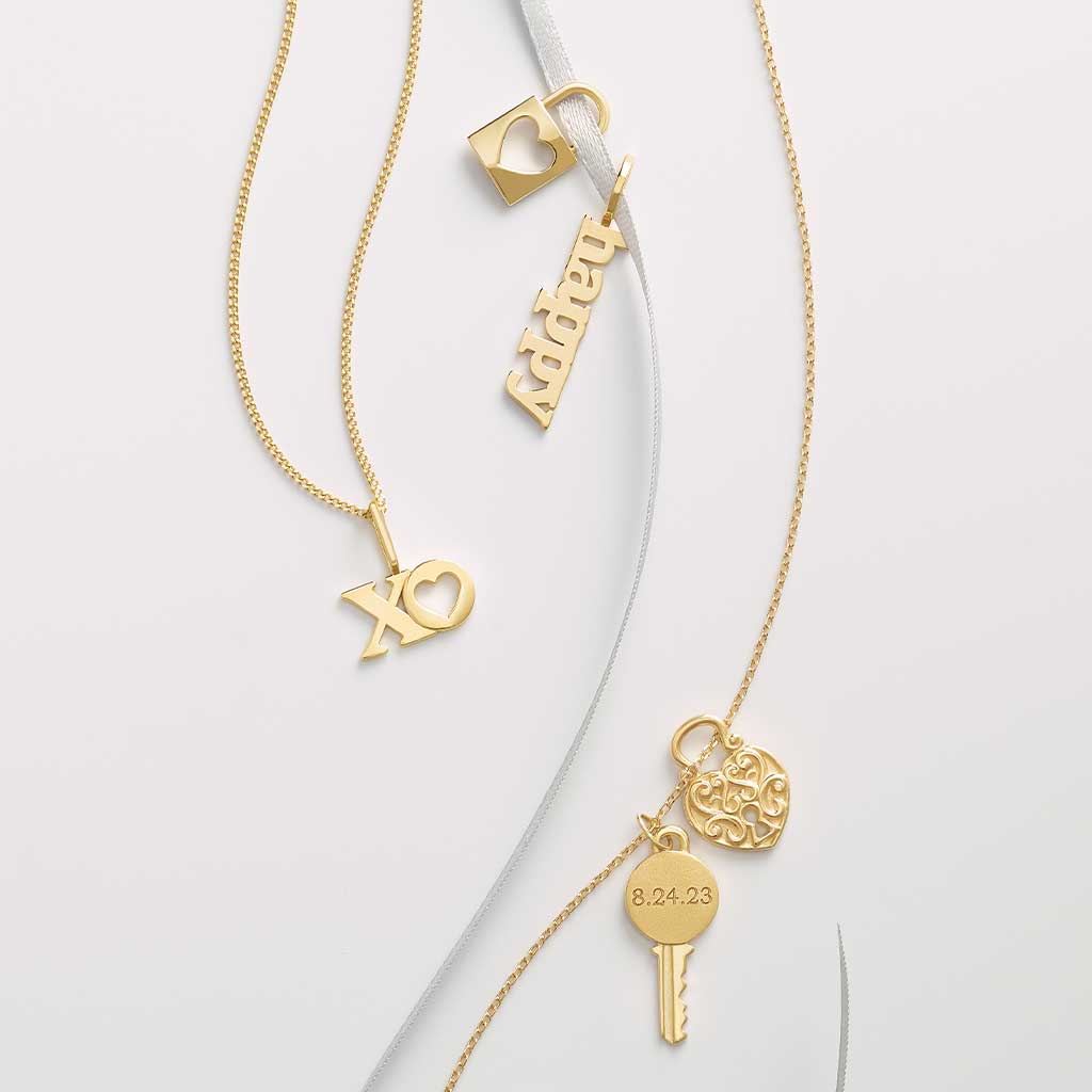 Tiny cable chain in 14K gold, showing clasp