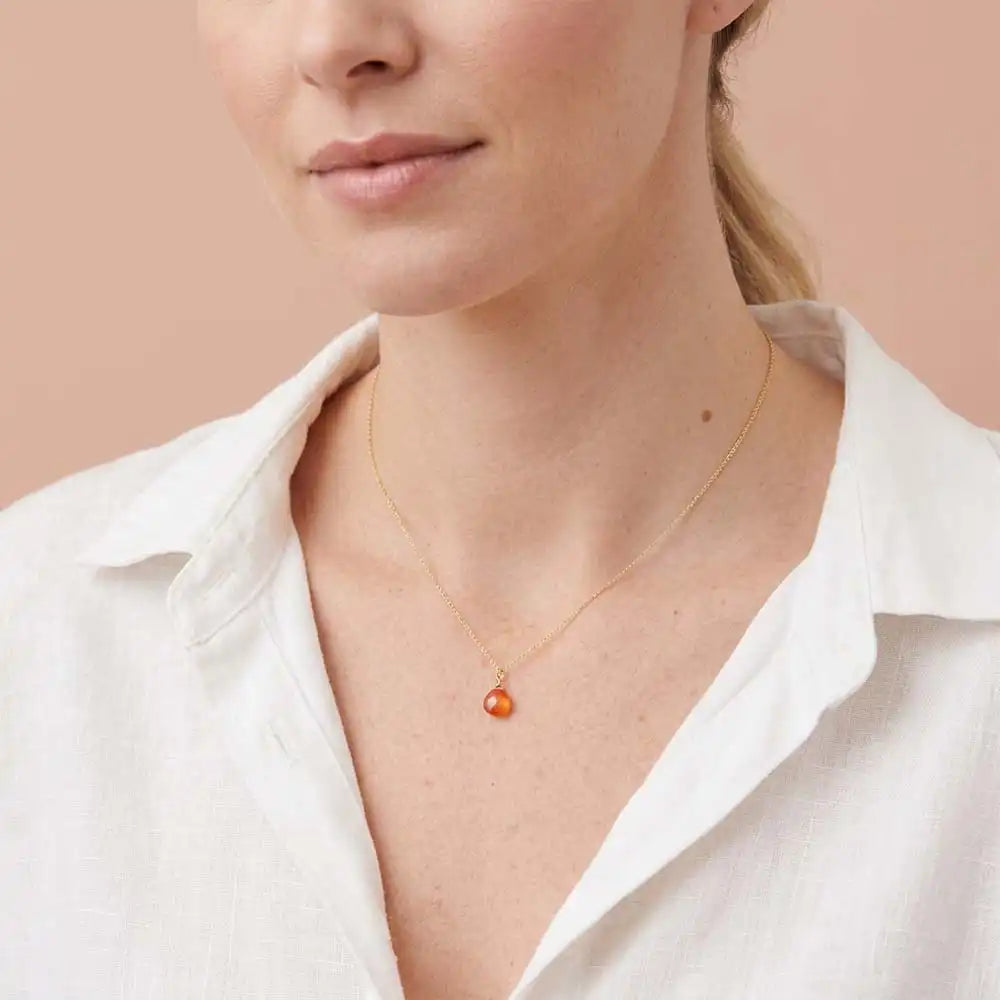 Carnelian drop necklace worn on model, lifestyle portrait