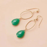 Faceted chrysoprase drop earrings in yellow gold fill, vivid apple-green gemstone teardrop briolette suspended from slim oval gold link, blush background. all-groups