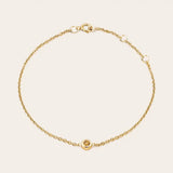 Bezel-set citrine bracelet flatlay showing warm golden stone on curb chain yellow gold variant--14K-yellow-gold variant--Citrine