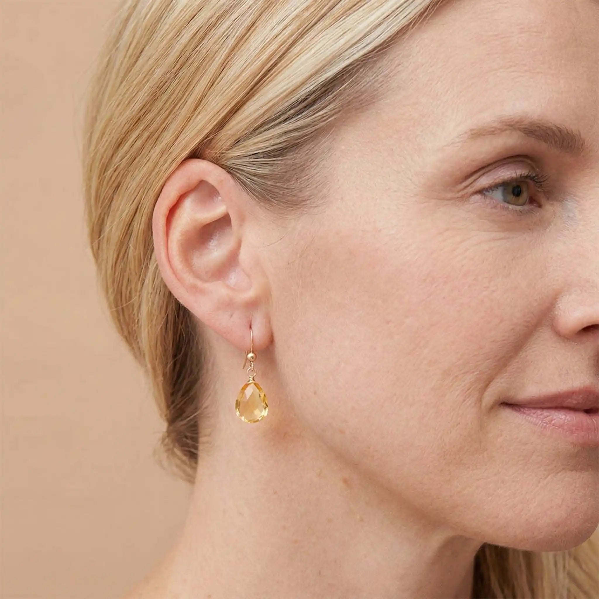 Drop earring in gold-fill shown on model