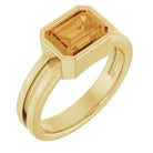 Bold emerald-cut citrine ring in 14K yellow gold, modern bezel style.