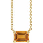Front view of emerald-cut citrine necklace in 14K yellow gold