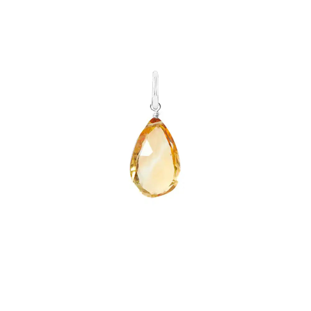 Natural citrine 11mm briolette charm in sterling silver, flat lay on neutral background
