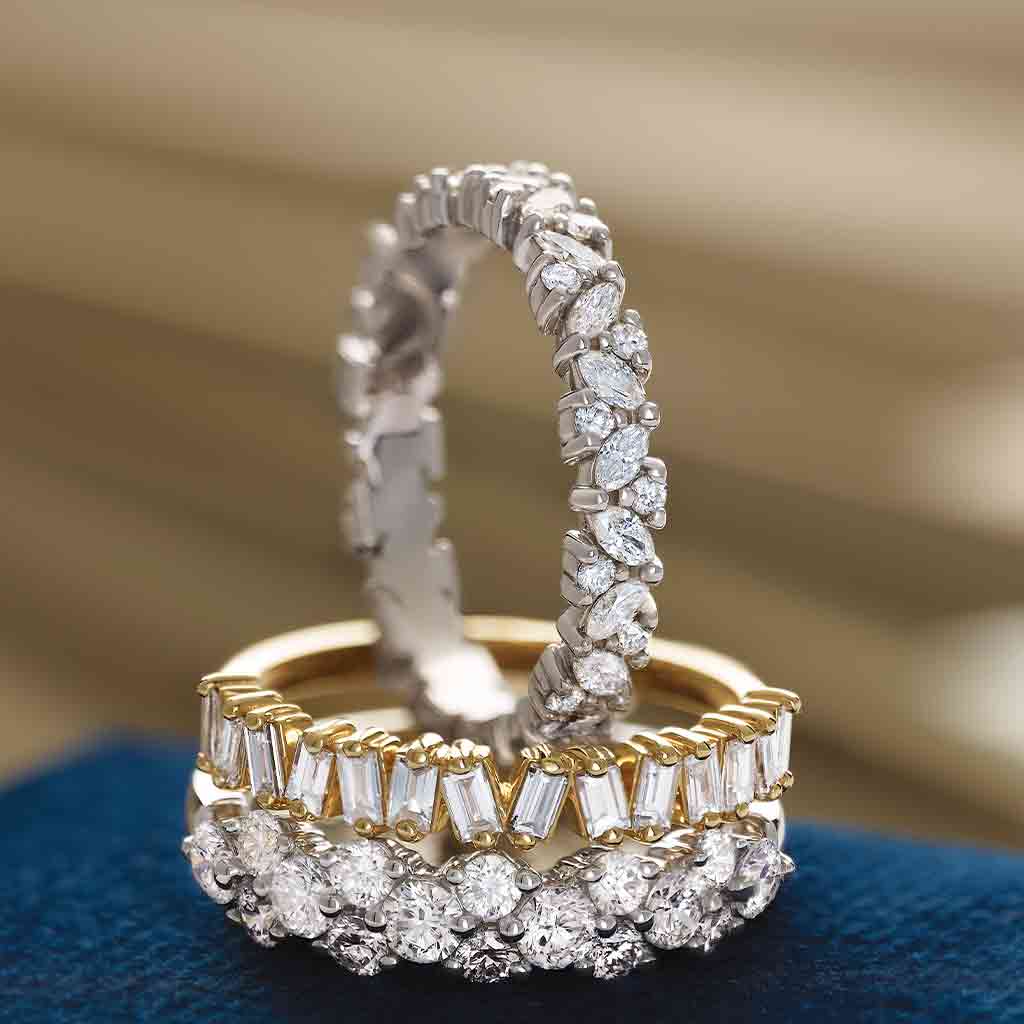 Natural diamond eternity band with cobblestone setting - styled with other rings