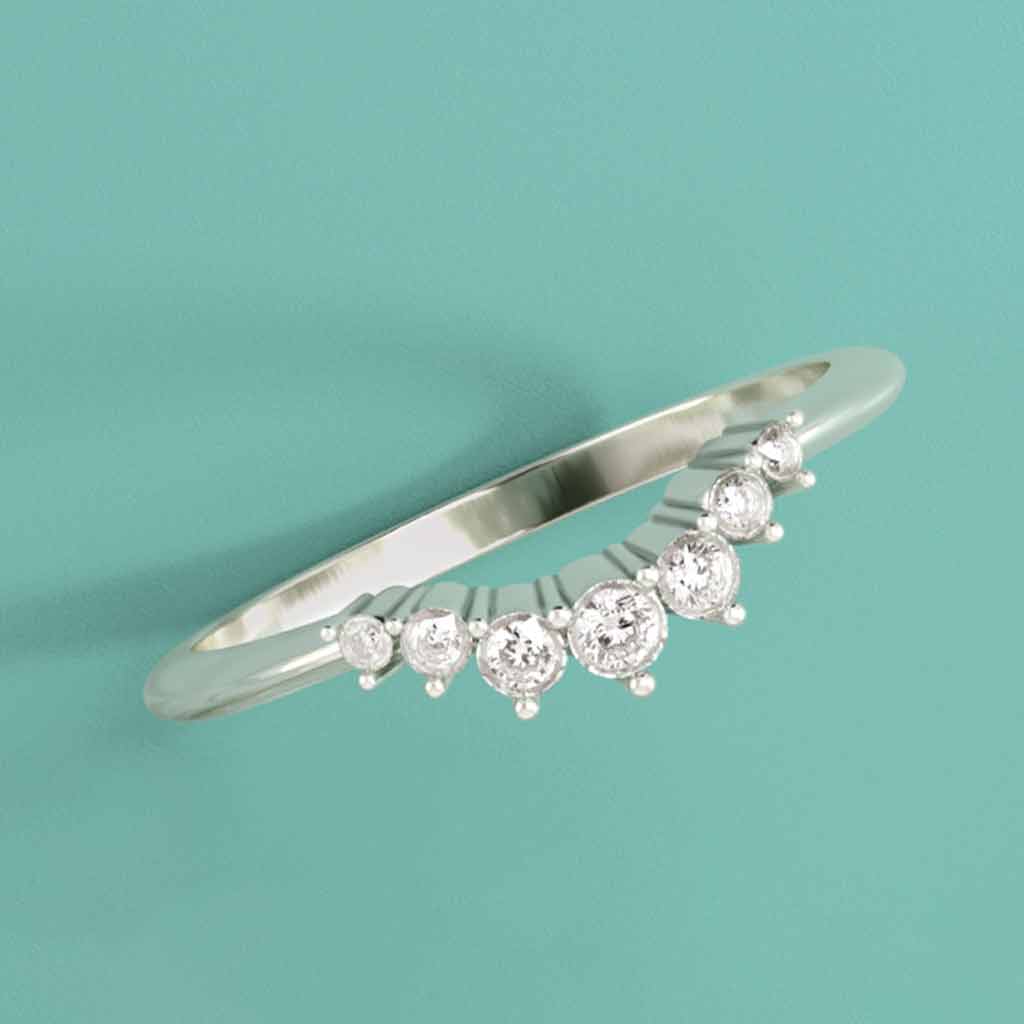 Petite contour diamond band in 14K gold, editorial close-up