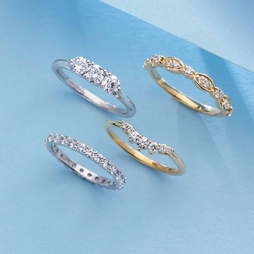 Petite contour diamond band stacked with engagement ring