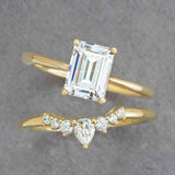 Contour diamond band in 14K yellow gold with pear and round diamonds styled with engagement ring