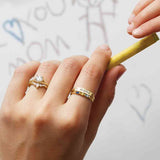Diamond V band styled with engagement ring