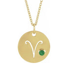 Dainty Aries zodiac pendant and gemstone charm necklace in polished 14K yellow gold.