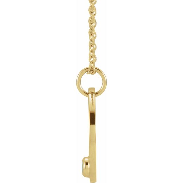 Dainty Cancer necklace featuring engraved medallion and blue aquamarine